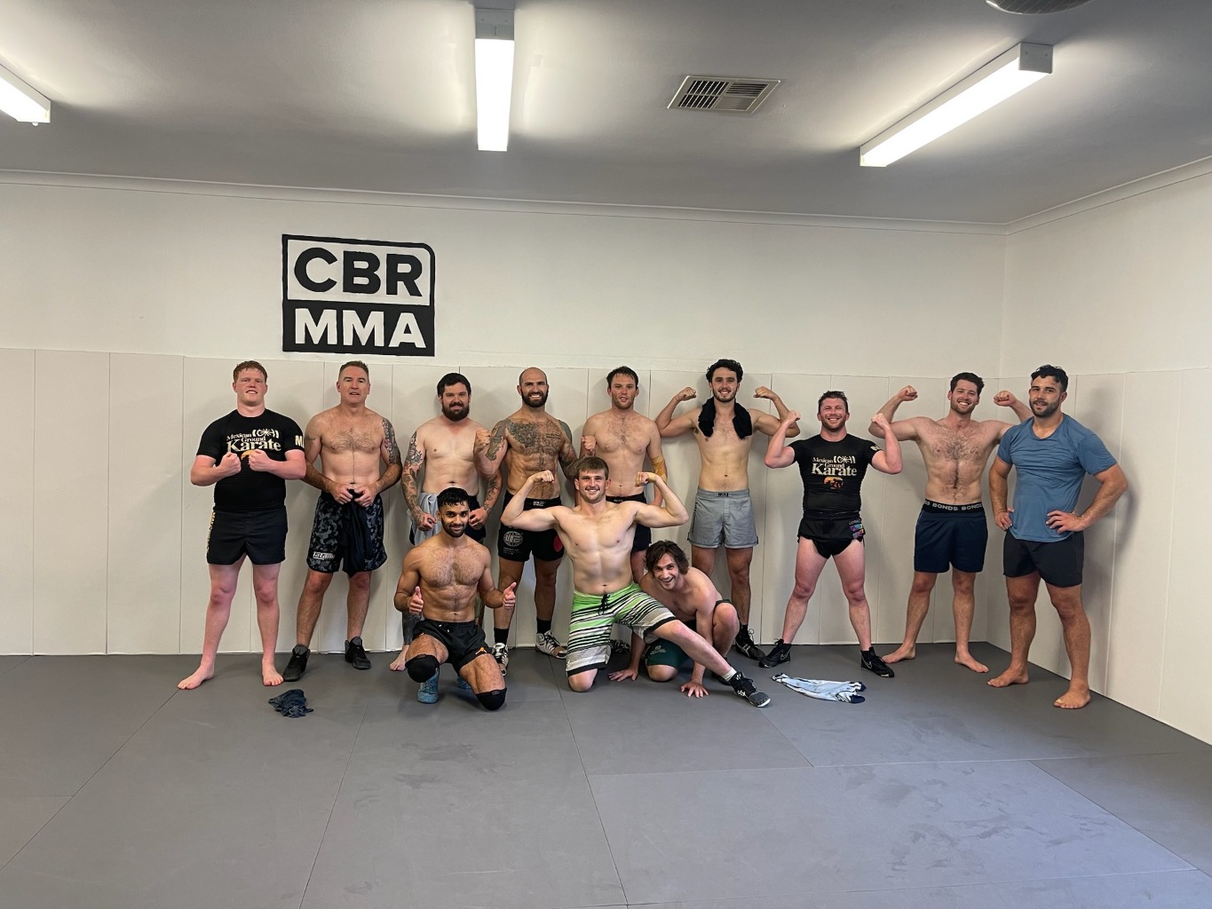 Wrestling group photo on the mats at Canberra MMA